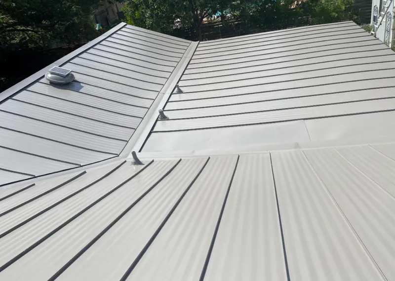 Solar attic fan installed on a metal roof for Roof Ventilation in Brooklyn Center