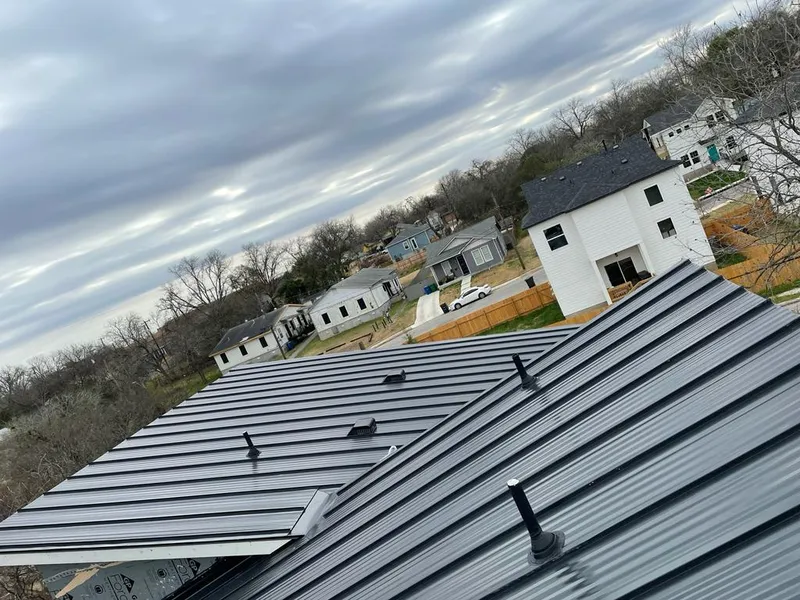 Standing seam metal roof panels with vents for Skylight Repair in Brooklyn Center